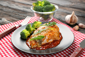 Delicious chicken parmesan meal with broccoli on plate