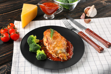 Delicious chicken parmesan meal with broccoli on plate
