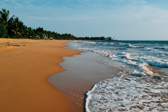 Beautiful Induruwa Beach Sri Lanka with blue water