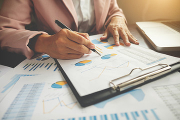 Business concept. Business people discussing the charts and graphs showing the results of their successful teamwork. .
