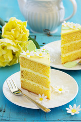 A piece of lemon sponge cake on a plate.