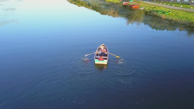 Tourists in a rowboat in the Danube delta