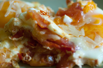 Poached Eggs with ham, chease onion and tomato.