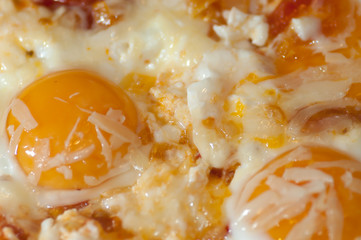 Poached Eggs with ham, chease onion and tomato.