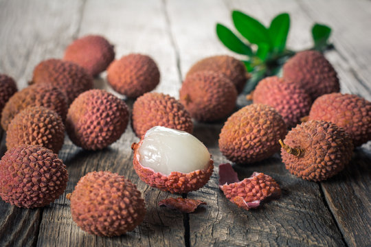 Lychees fruits on wooden background