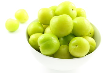 fresh turkish can erik plum fruits in a small white bowl