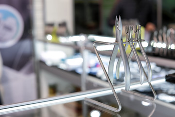 Set of professional dental tools on glass shelf
