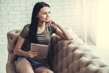 Beautiful girl with gadget