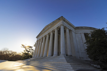 Sunrise beside the classical styled portico of the historic Thomas Jefferson Memorial, West Potomac Park, Washington DC