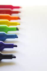 Fototapeta premium Rainbow colored marker tips on white background