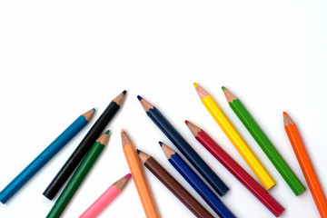 Color pencils on white background, copy space.