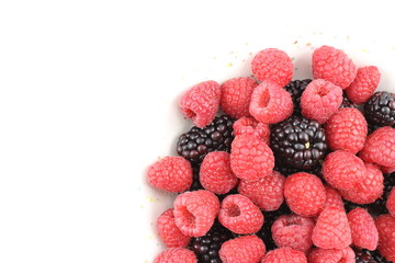 fresh blackberry and red raspberry fruits in a small white bowl
