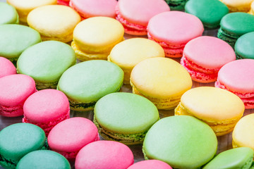 Fototapeta na wymiar Colorful tasty macaroons, a french sweet delicacy, macaroon texture close up