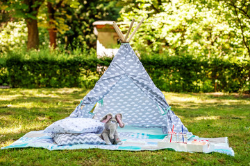Wigwam for recreation for children. The concept of lifestyle and decor. © Olha Tsiplyar
