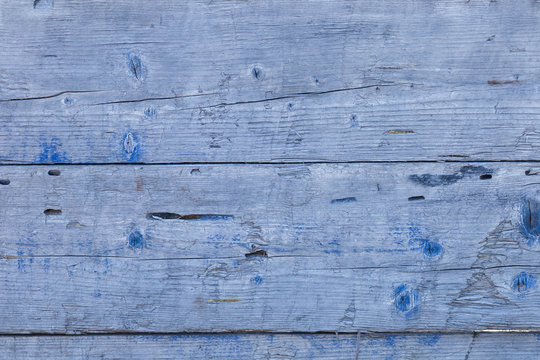 old wooden background with a blue tint texture, close-up