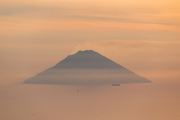 Volcano Stromboli view at sunrise sunset from Salina Eolian island in summer