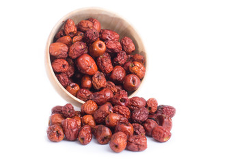dried jujube fruits, chinese herbal medicine in bowl isolated on white background