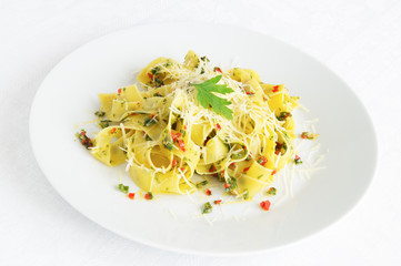 pasta with garlic, pepper, green onions, and parsley sprinkled with parmesan