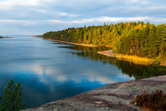 Scandinavian autumn colours - yellow leaves and blue sea 3