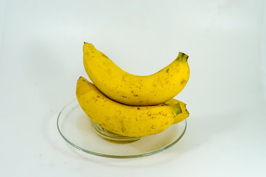 Fresh banana in a glass dish .