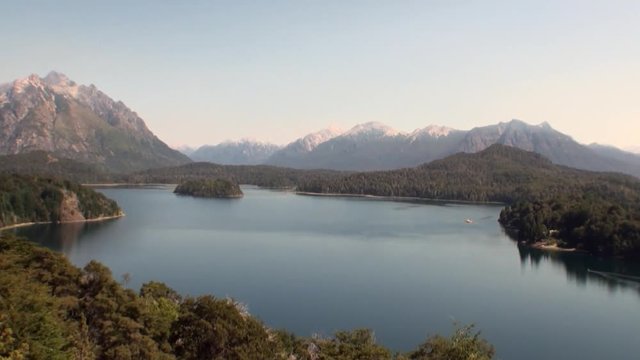 Mountain lake show quiet and calm water in Patagonia Argentina. Unique landscape of wildlife. Beautiful nature background. Travel and tourism in picturesque world of stone rocks and hills.