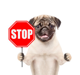 Dog holding stop sign. Isolated on white background