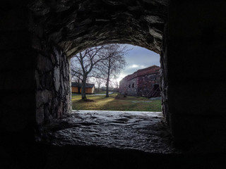 Scandinavian plot, view through the loophole of the fortress