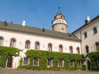 Fototapeta na wymiar Sychrov Castle courtyard. Neo-Gothic style chateau near Turnov, Czech Republic.