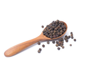 Close up peppercorns in wooden spoon isolated on white background