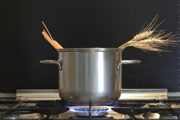 Pot with spaghetti and wheat ears