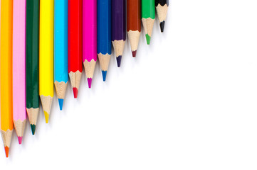 Colored pencils on white background
