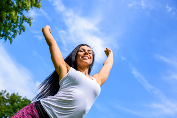 Beautiful young sporty girl in a park	