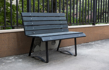 Empty Bench With Cracked Tiles . Vandalism in the City . Impotence of the Government