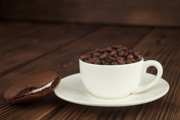 Chocolate Whoopie pie and coffee on the wooden table. horizontal