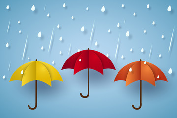 Colorful umbrella with rain , paper art style © supakritleela