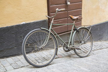 Fototapeta na wymiar Old Bike in Old Town; Stockholm