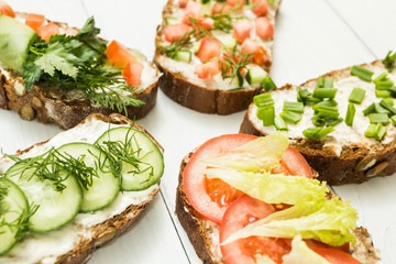 A set of homemade vegetarian snacks on a white background.