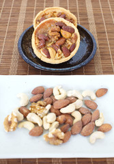 Mixed nuts and a baked dish tart