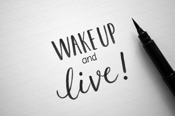 Hand lettered quote “WAKE UP AND LIVE!”