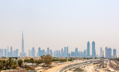 Fototapeta premium Hazy City Skyline with Burj Khalifa Skyscraper
