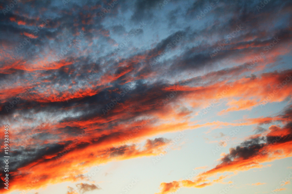 Wall mural Abstract natural background with a celestial cloudy landscape at sunset