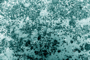 Cyan toned rusted metal surface.