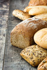 Mixed breads on wooden table
