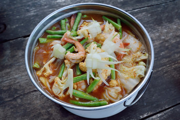 Thai food, Spicy and sour soup with mix vegetables and prawn or Gang Som in Thai name