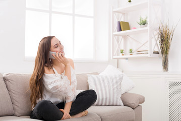 Girl at home chatting on mobile