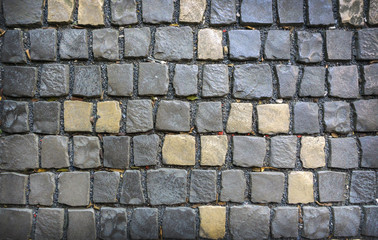 Gray and yellow paving stones Backgrounds and textures.