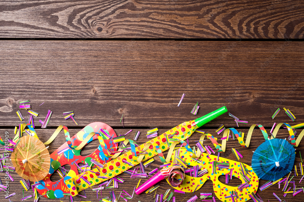 Wall mural colorful party background on wooden table