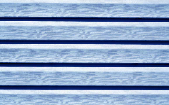 Blue color plastic panel wall pattern.