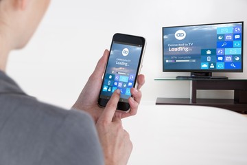 Composite image of close-up of businesswoman using mobile phone