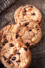 Chocolate chip cookies on dark old wooden table with place for text.,  freshly baked. Selective Focus with Copy space.